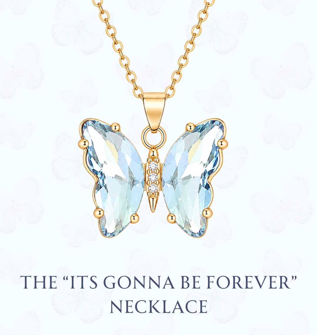 Gold butterfly pendant necklace with light blue faceted crystal wings and a small center accent, shown on a white background with the text 'THE "ITS GONNA BE FOREVER" NECKLACE' and the website 'www.hebejewel.