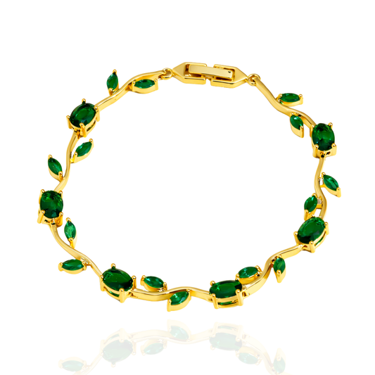 Gold bracelet with green gemstones on a white background