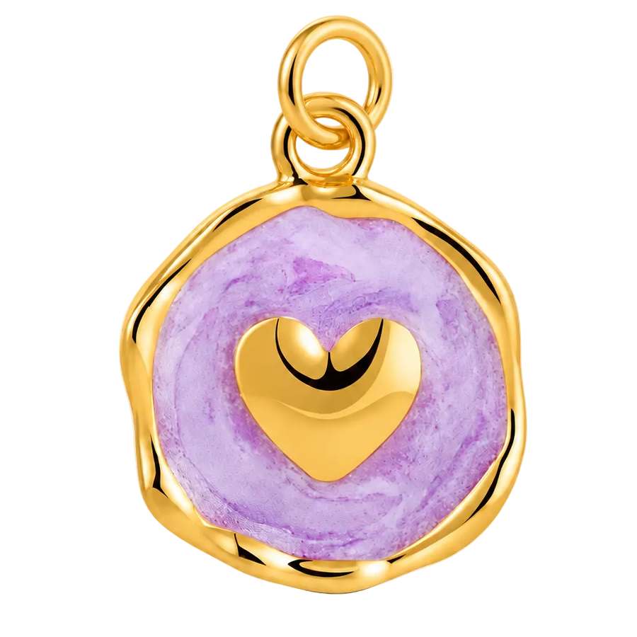 A gold-plated pendant charm featuring a round, irregularly shaped purple marbled face with a polished gold heart in the center and a top hanging loop, shown on a clean white background.