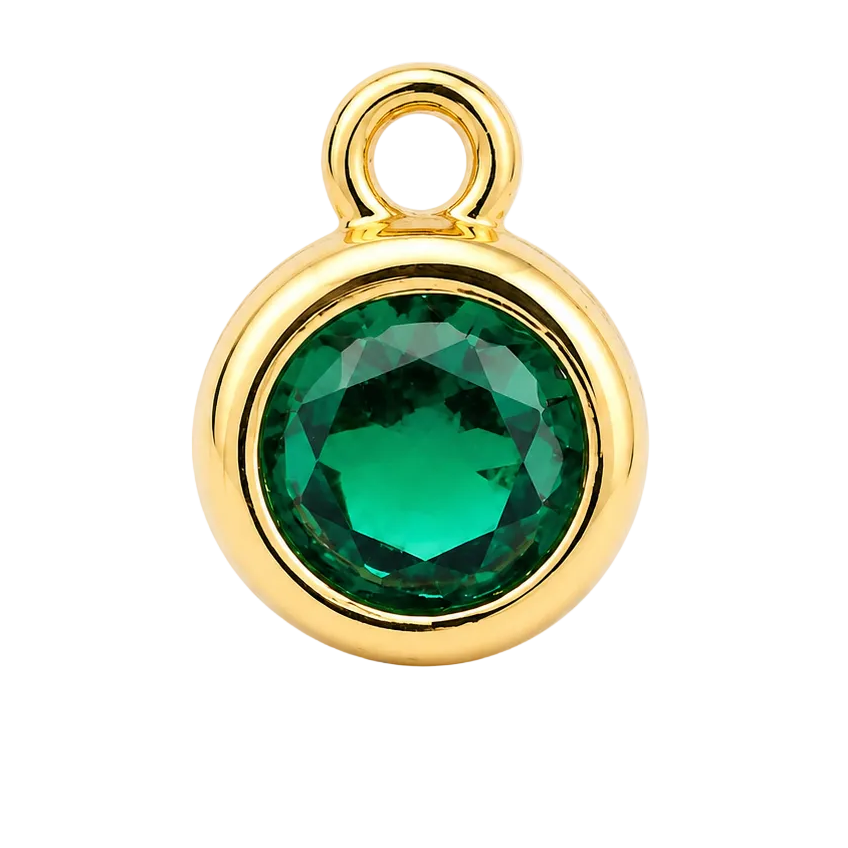 A round gold pendant charm featuring a faceted green gemstone in a bezel setting, complete with a top loop, shown on a clean white background.