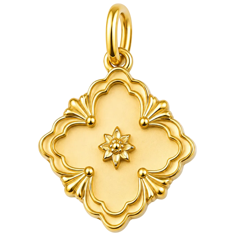 A gold pendant charm with a decorative quatrefoil design and a small star motif in the center, shown on a plain white background.