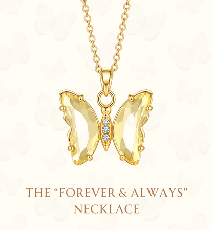 A gold butterfly pendant necklace with clear faceted gemstones on a white background, featuring the text 'THE "FOREVER & ALWAYS" NECKLACE' and the website 'www.hebejewel.