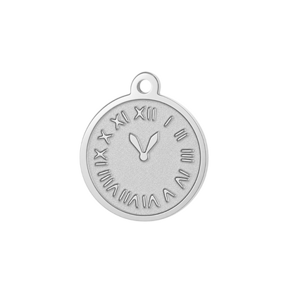 A silver-toned round clock face pendant charm with Roman numerals and clock hands, shown on a plain white background with a green 'NEW ARRIVAL' banner in the top-left corner.