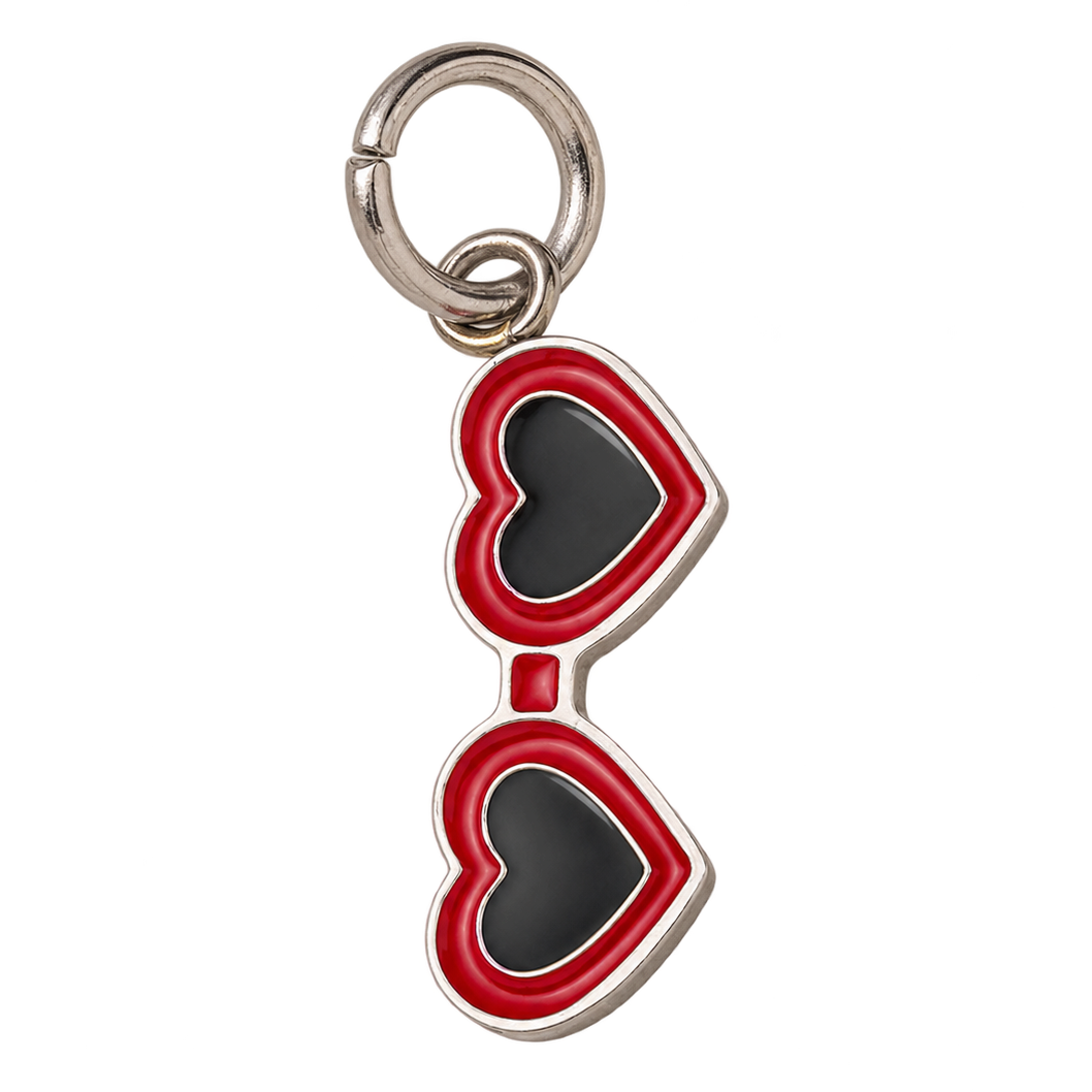 A heart-shaped sunglasses charm with red and black enamel details and a silver-tone metal clasp, shown on a plain white background.