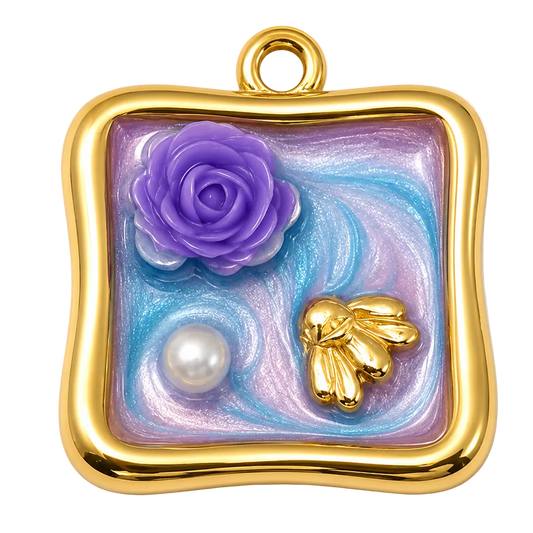 A square gold pendant with a rounded wavy border, featuring a purple rose, a small gold bee, and a white pearl on a swirling blue and lavender background, shown on a plain white background.