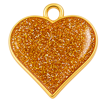 A heart-shaped pendant charm with a gold-tone metal border and loop, filled with dense reflective orange glitter, shown on a plain white background.