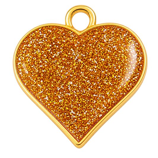 A heart-shaped pendant charm with a gold-tone metal border and loop, filled with dense reflective orange glitter, shown on a plain white background.